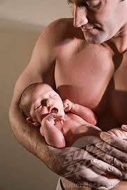 muscle man with baby